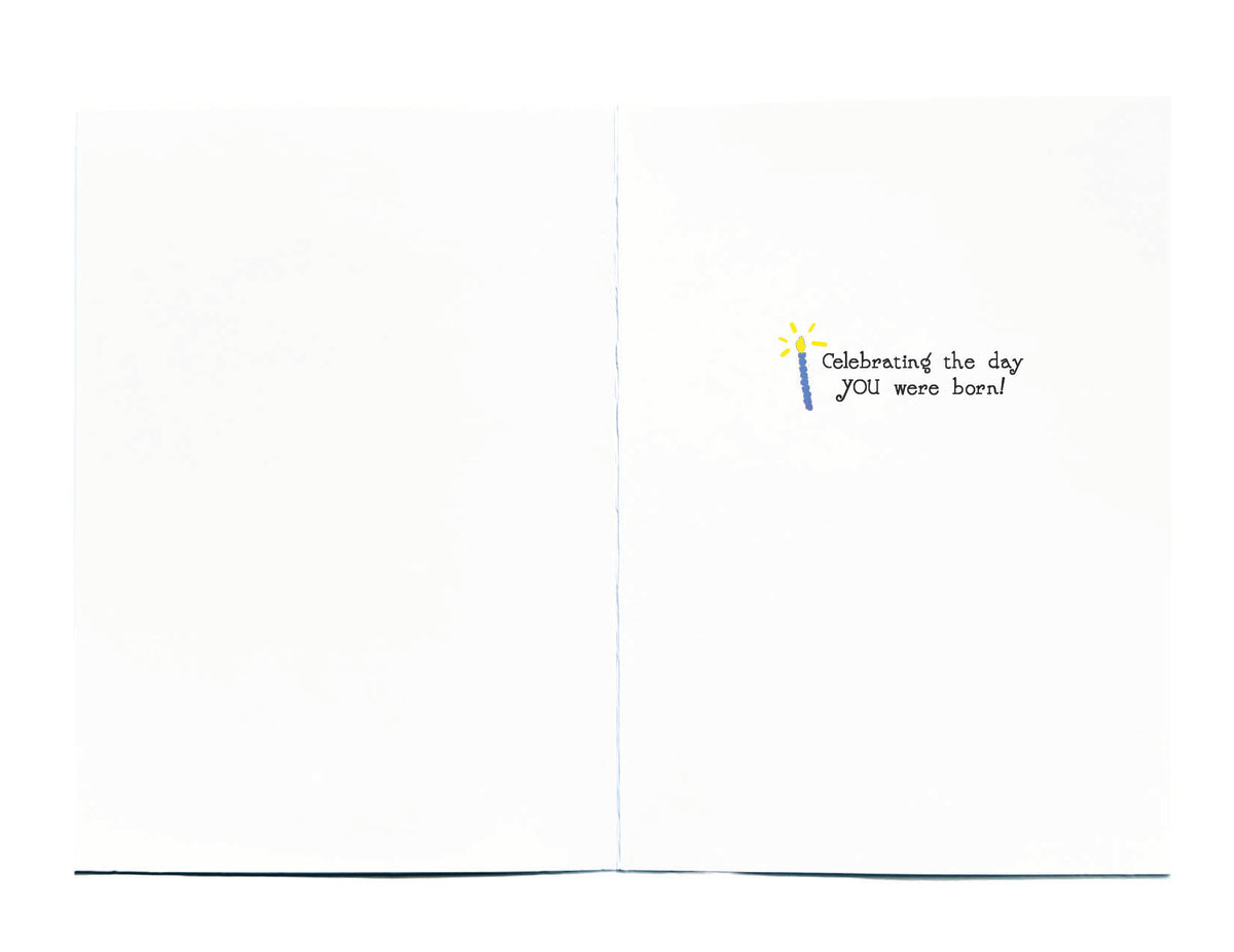A small printed message on the right page reading 'Celebrating the day YOU were born!' 