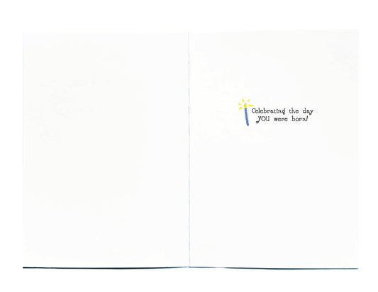 A small printed message on the right page reading 'Celebrating the day YOU were born!' 