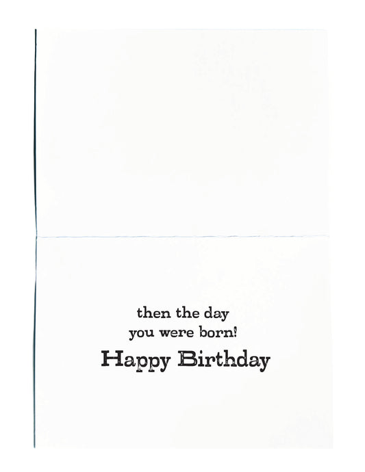 A folded white greeting card with black printed text reading 'then the day you were born! Happy Birthday' on the lower half.