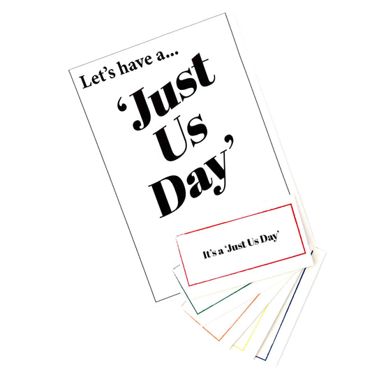 A set of printed cards or labels on a white background, featuring the phrase “Let’s have a...Just Us Day"