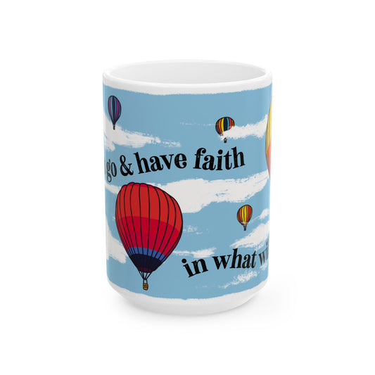 Mug with hot air balloon design and motivational quote on a blue sky background
