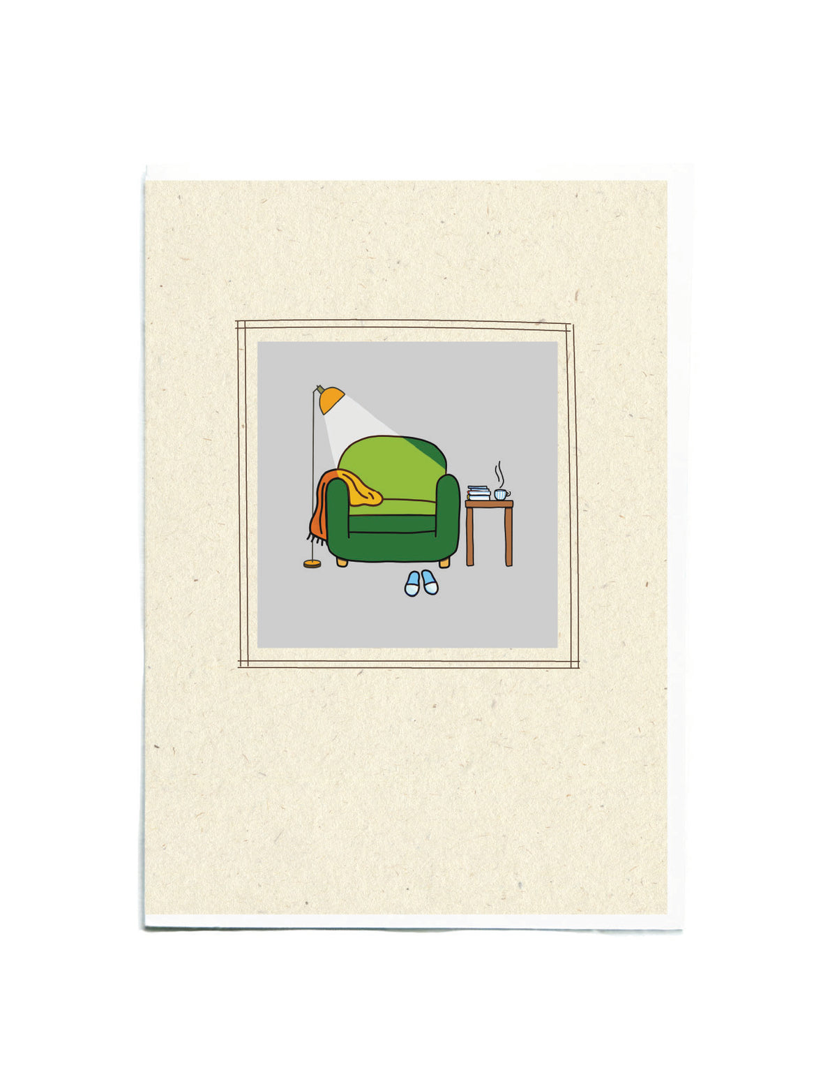 A birthday card featuring a minimalist illustration of a green armchair with a red throw blanket, a floor lamp, a small side table, and blue slippers, centered on a textured cream background.